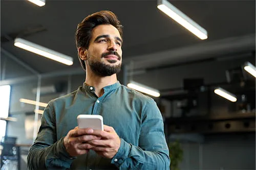 Man holding smartphone Man holding smartphone