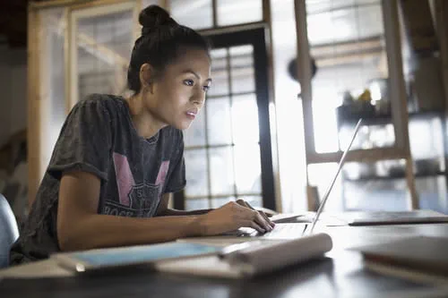 woman in front of a laptop woman in front of a laptop