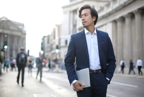 businessman holding a laptop