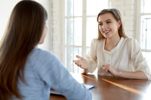 two businesswomen talking two businesswomen talking