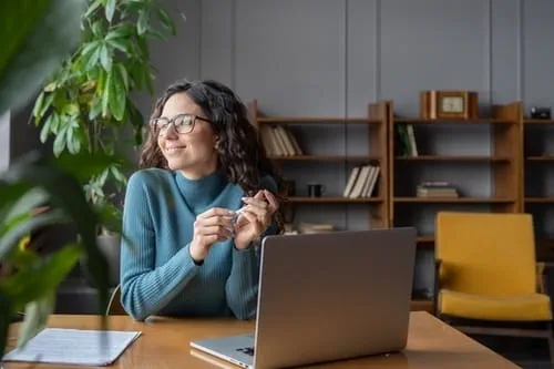 woman in front of a laptop woman in front of a laptop