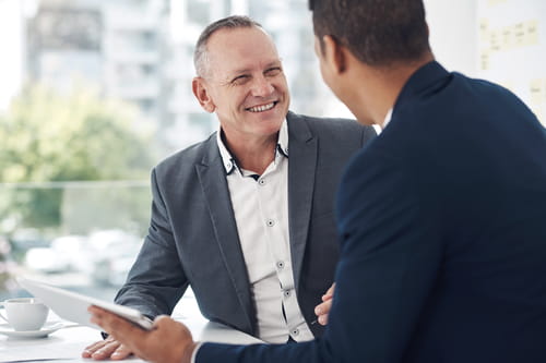Two colleagues discussing a report