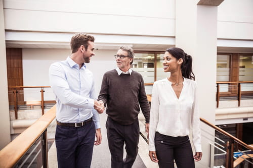 Three businesspeople talking