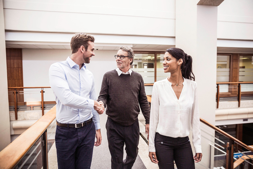 Three businesspeople talking Three businesspeople talking