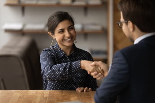 A businesswoman and businessman shaking hands A businesswoman and businessman shaking hands