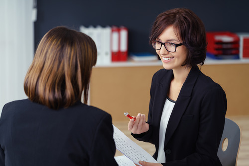 two businesswomen talking two businesswomen talking