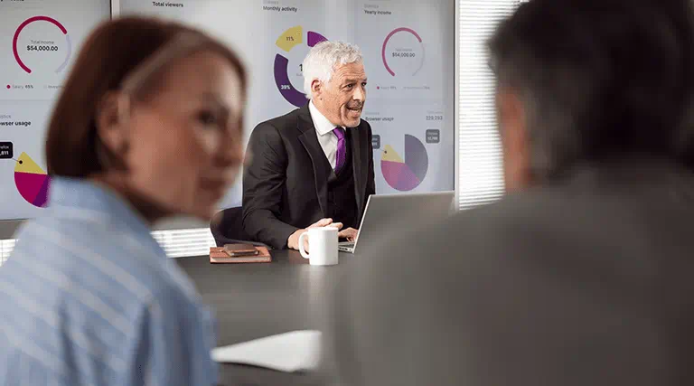 Three colleagues in an office meeting Three colleagues in an office meeting