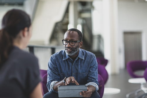 two businesspeople talking two businesspeople talking
