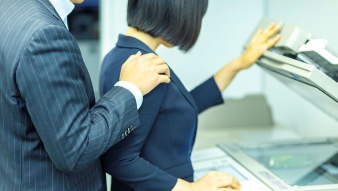 woman next to copier woman next to copier