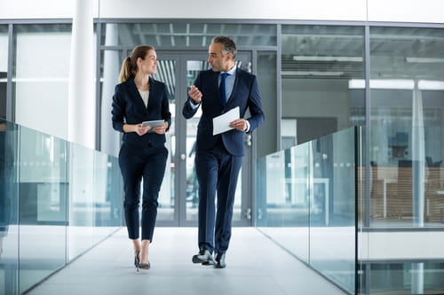 two businesspeople walking