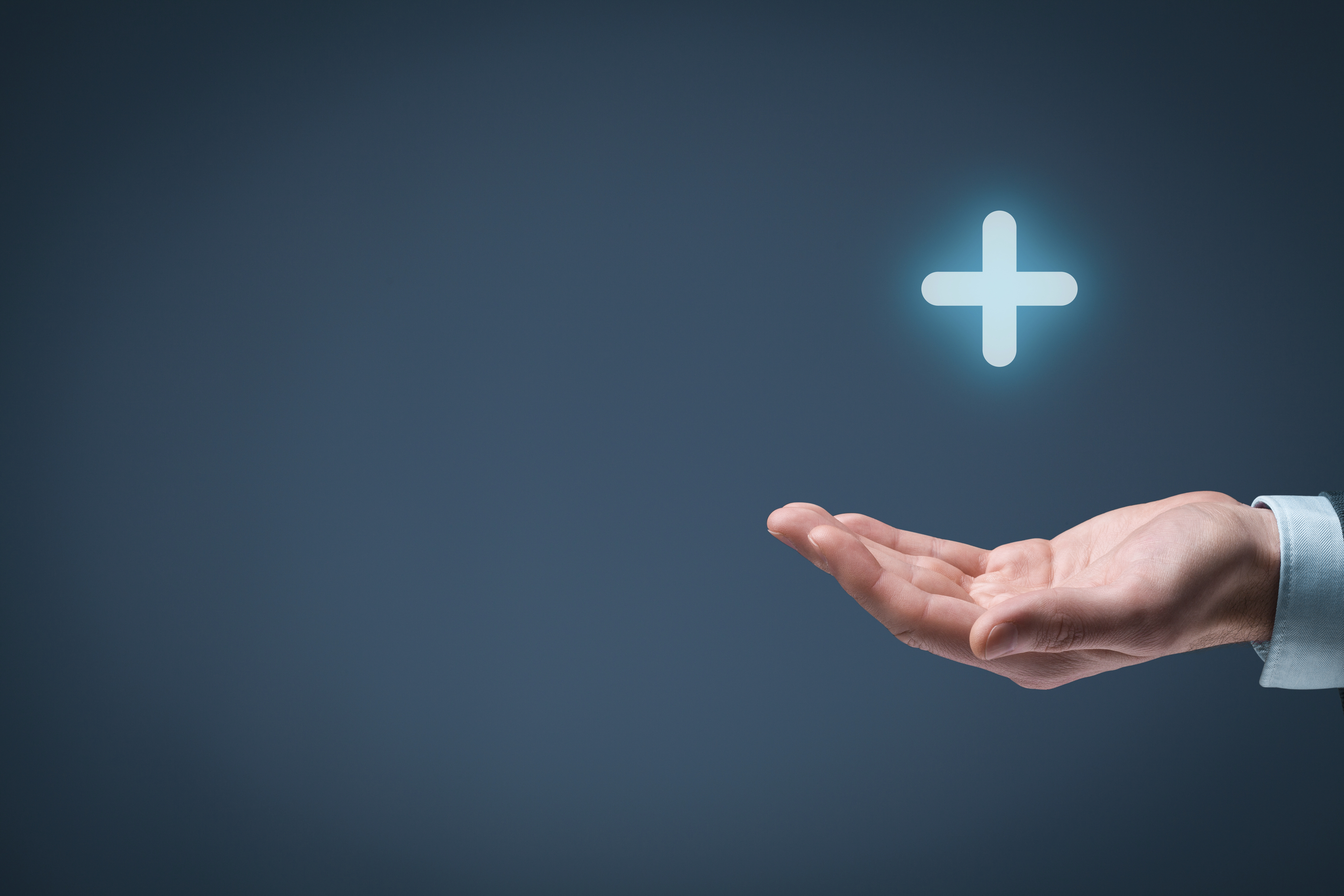 outstretched hand with a plus sign