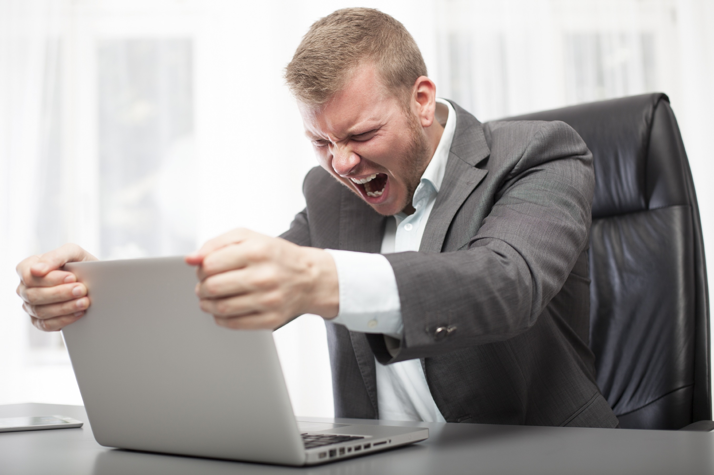 man yelling at computer