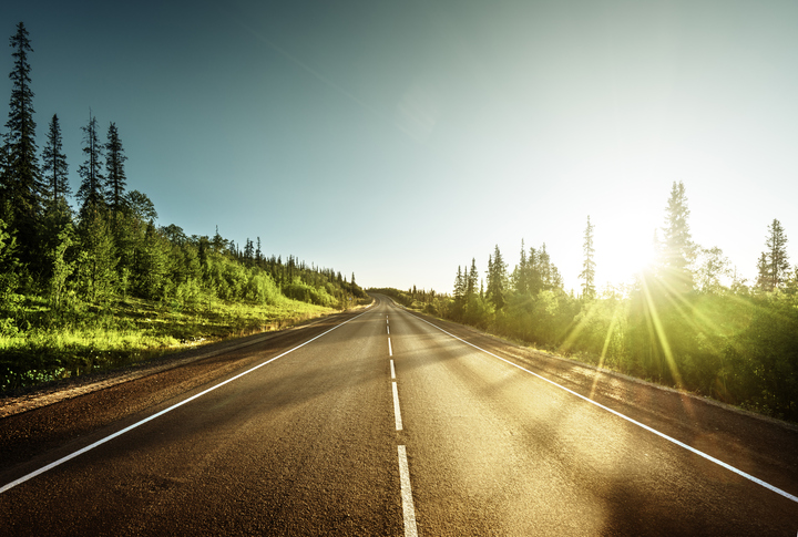 sunrise on an open, empty road