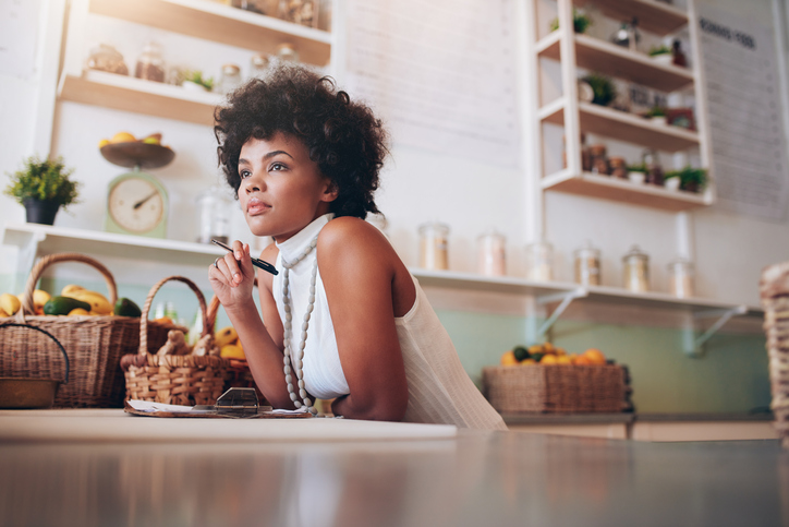 woman sitting at desk and thinking