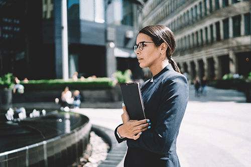 Smiling, well-dressed woman on the move