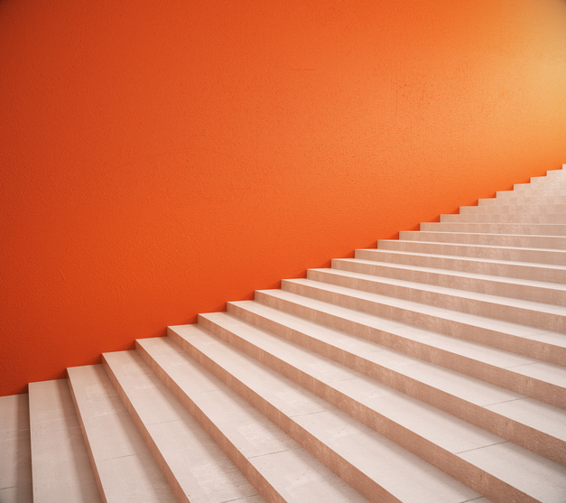 Side view of interior with bright orange wall and stairs