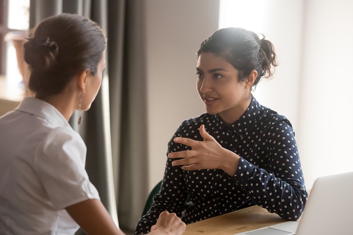 two ladies having a meeting