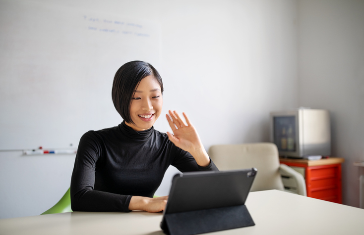 woman in office on video call