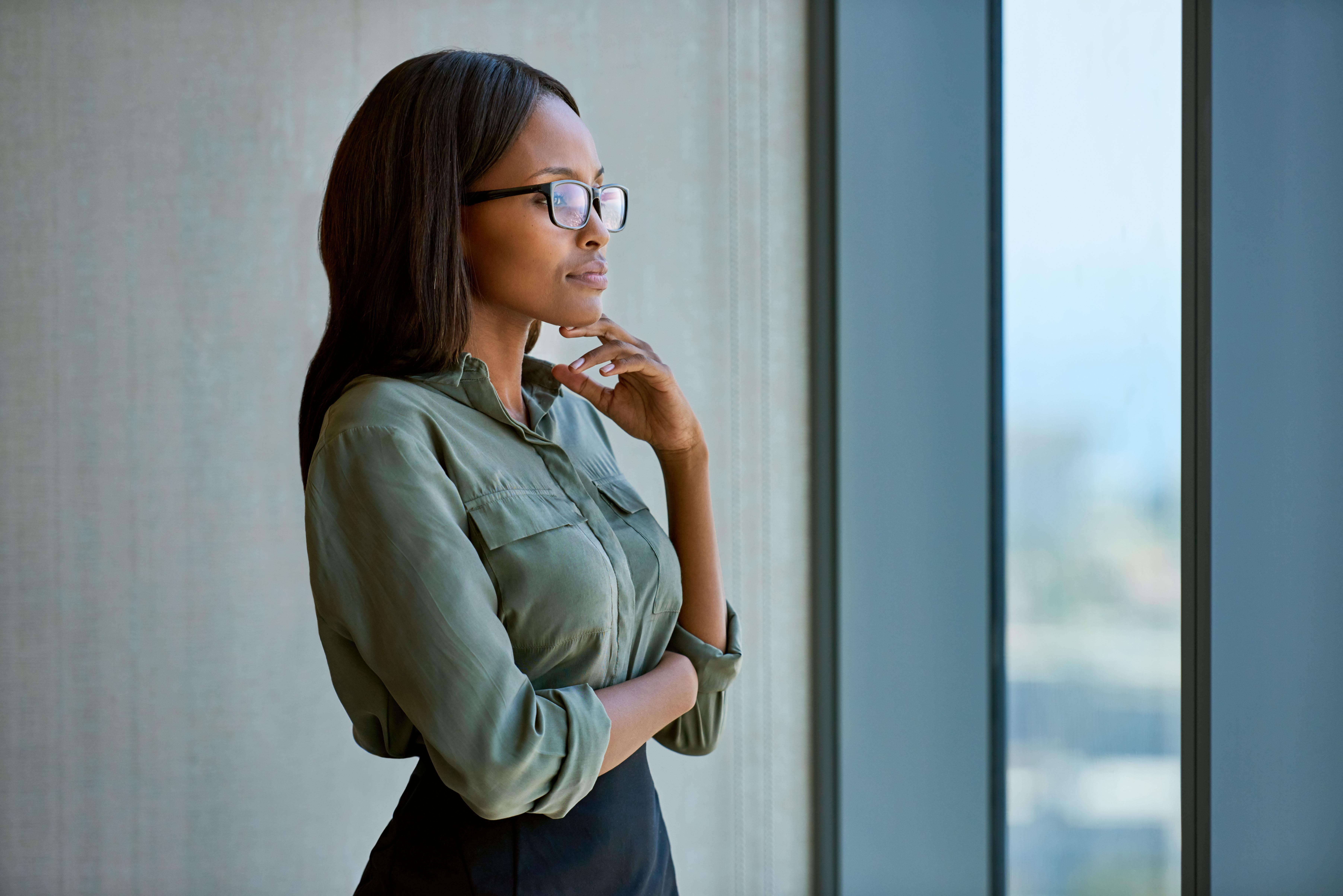 Woman seeing through glass window